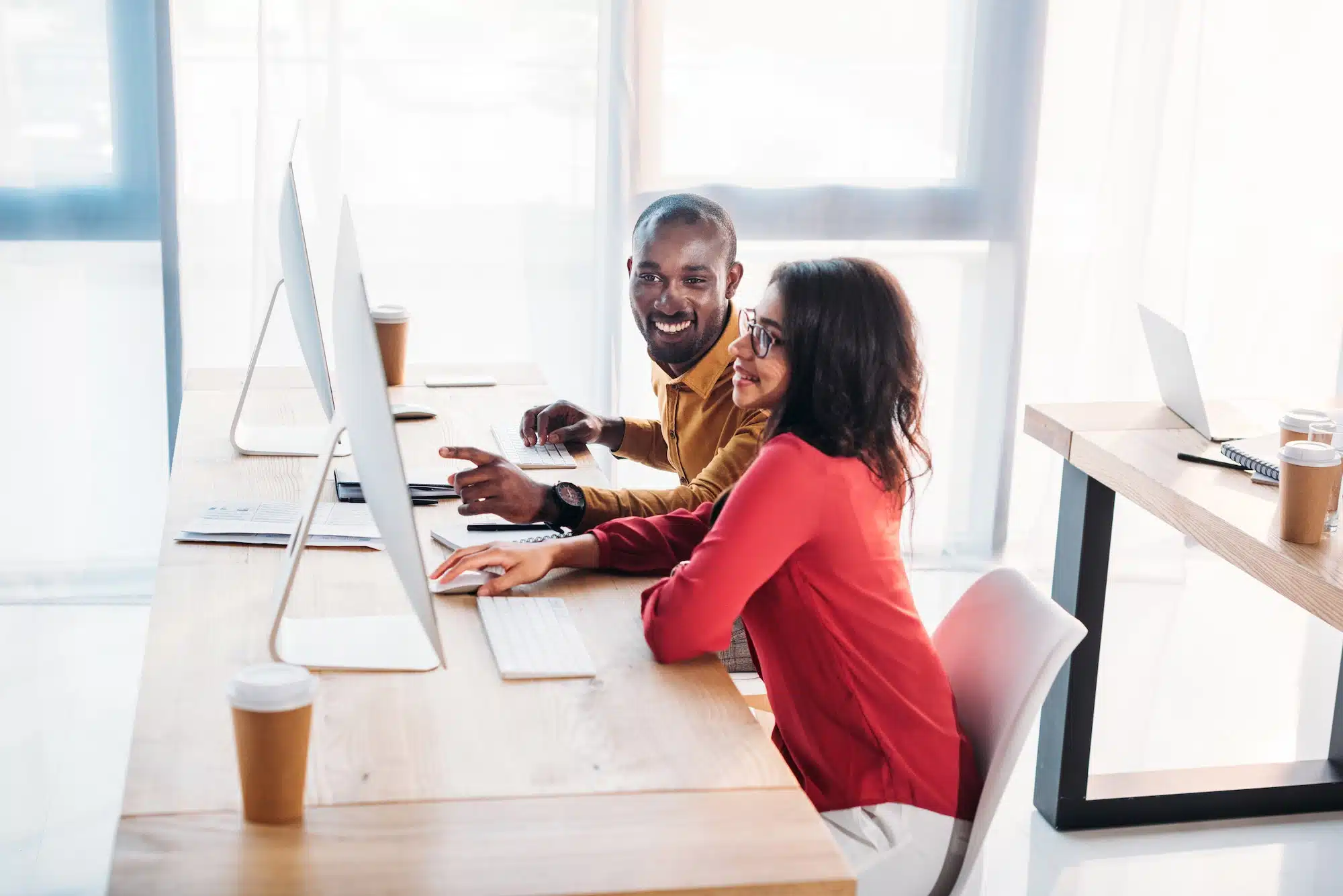 side view of african american business people working at workplace in office