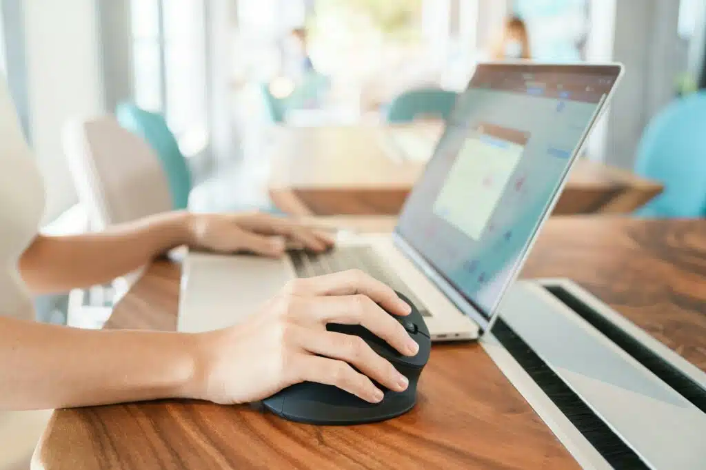 woman hand using computer ergonomic mouse