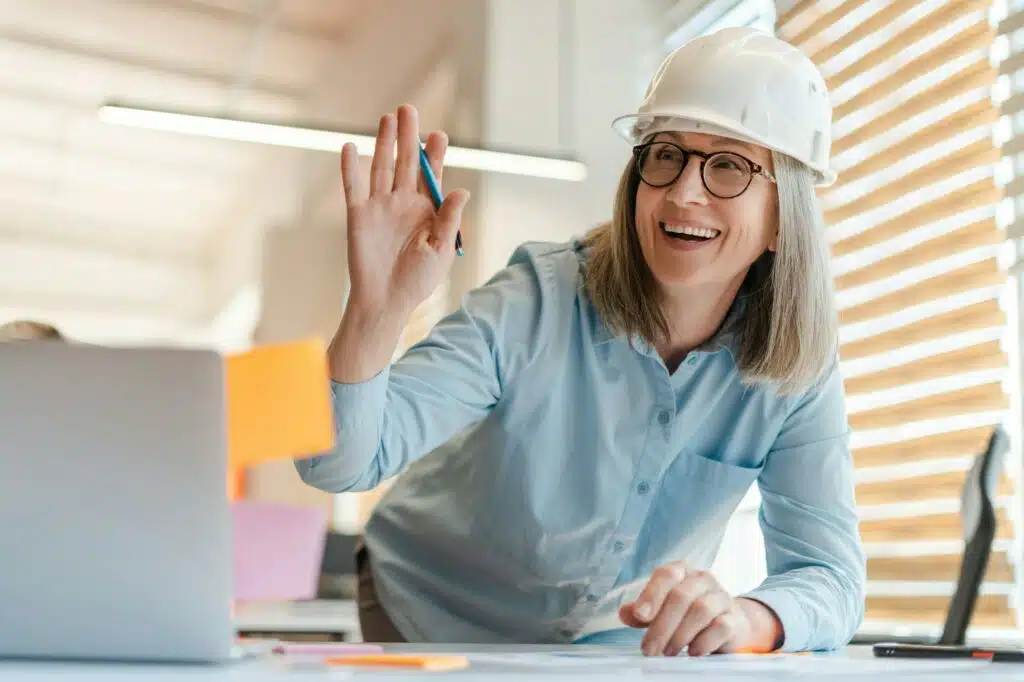 Portrait of Caucasian smiling senior female architect, design engineer at workplace