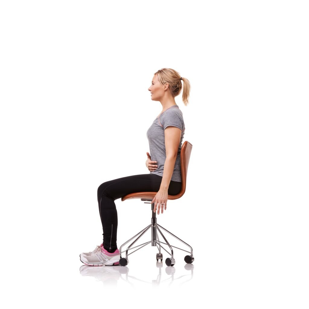 Perfect for your posture. Shot of a sporty woman doing stretches on a chair.
