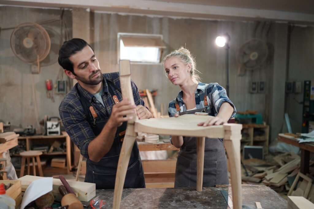 Carpenters Assembling Furniture, small business workshop office background.