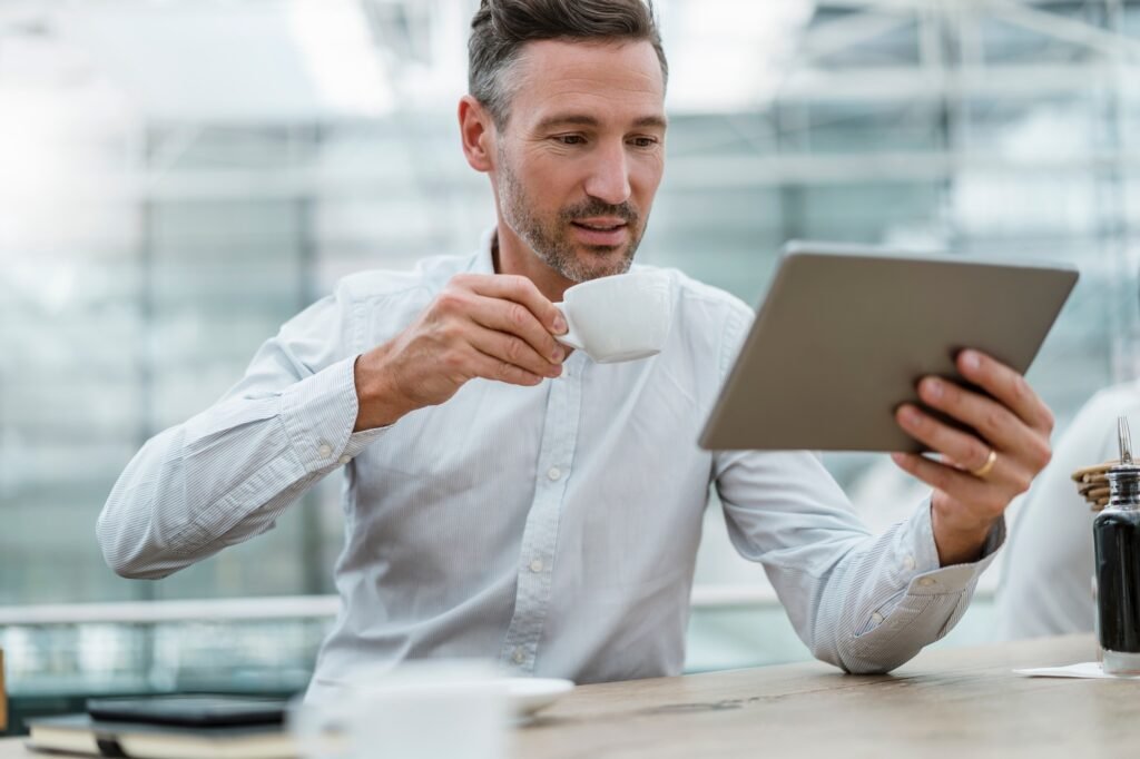 Businessman using tablet in a cafe