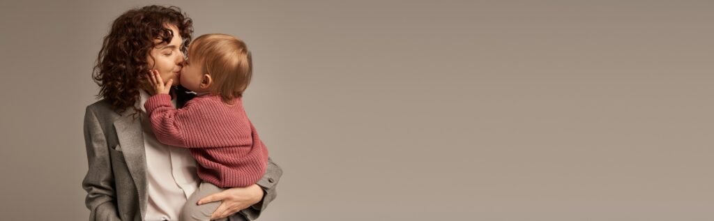 work life balance concept,curly woman in suit kissing daughter